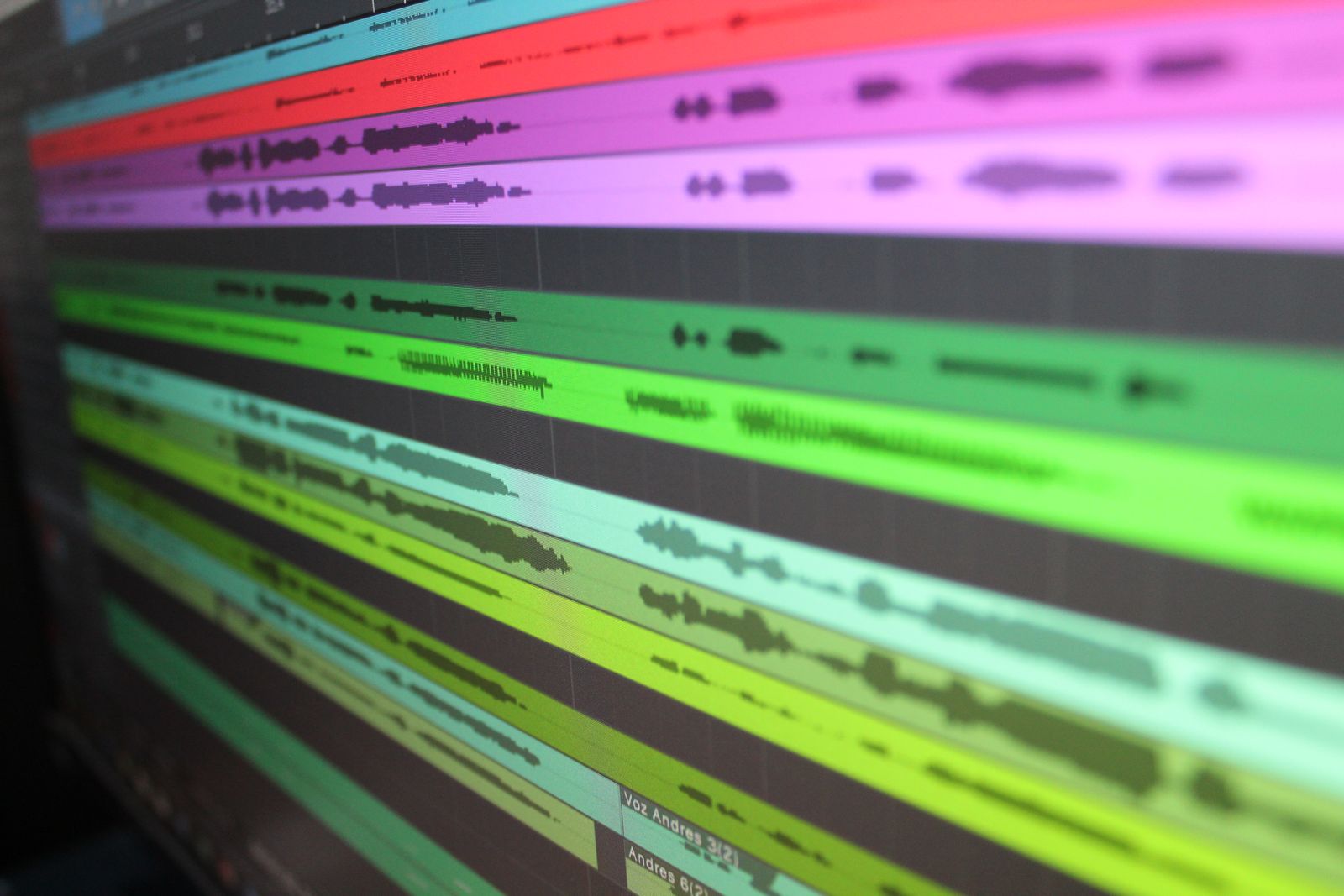 Audio waveform tracks on a screen, representing spoken English pronunciation being analyzed